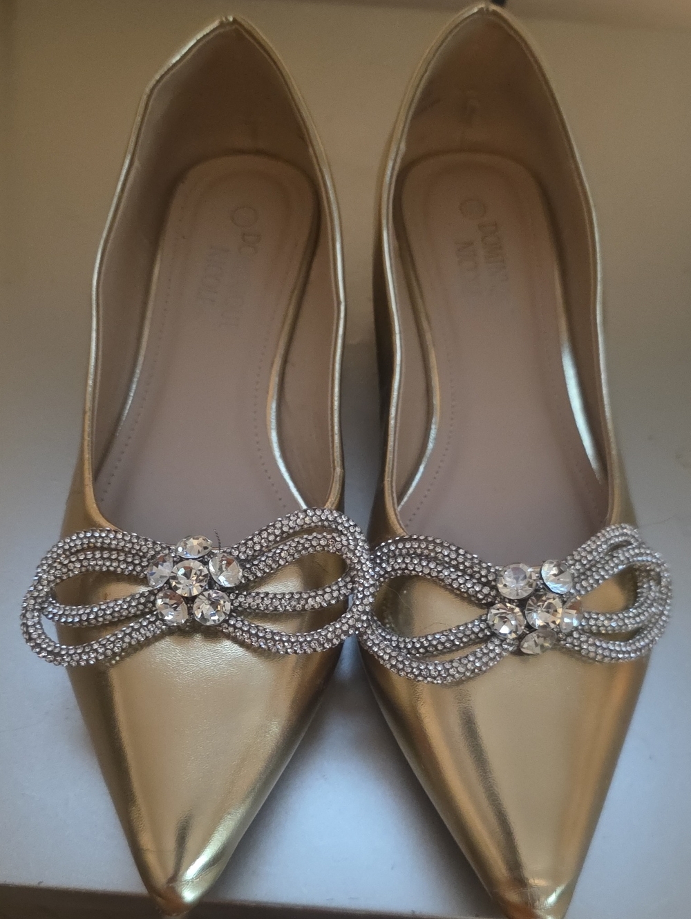 Dominique Gold Pointed Flats with Crystal Bow Accents
